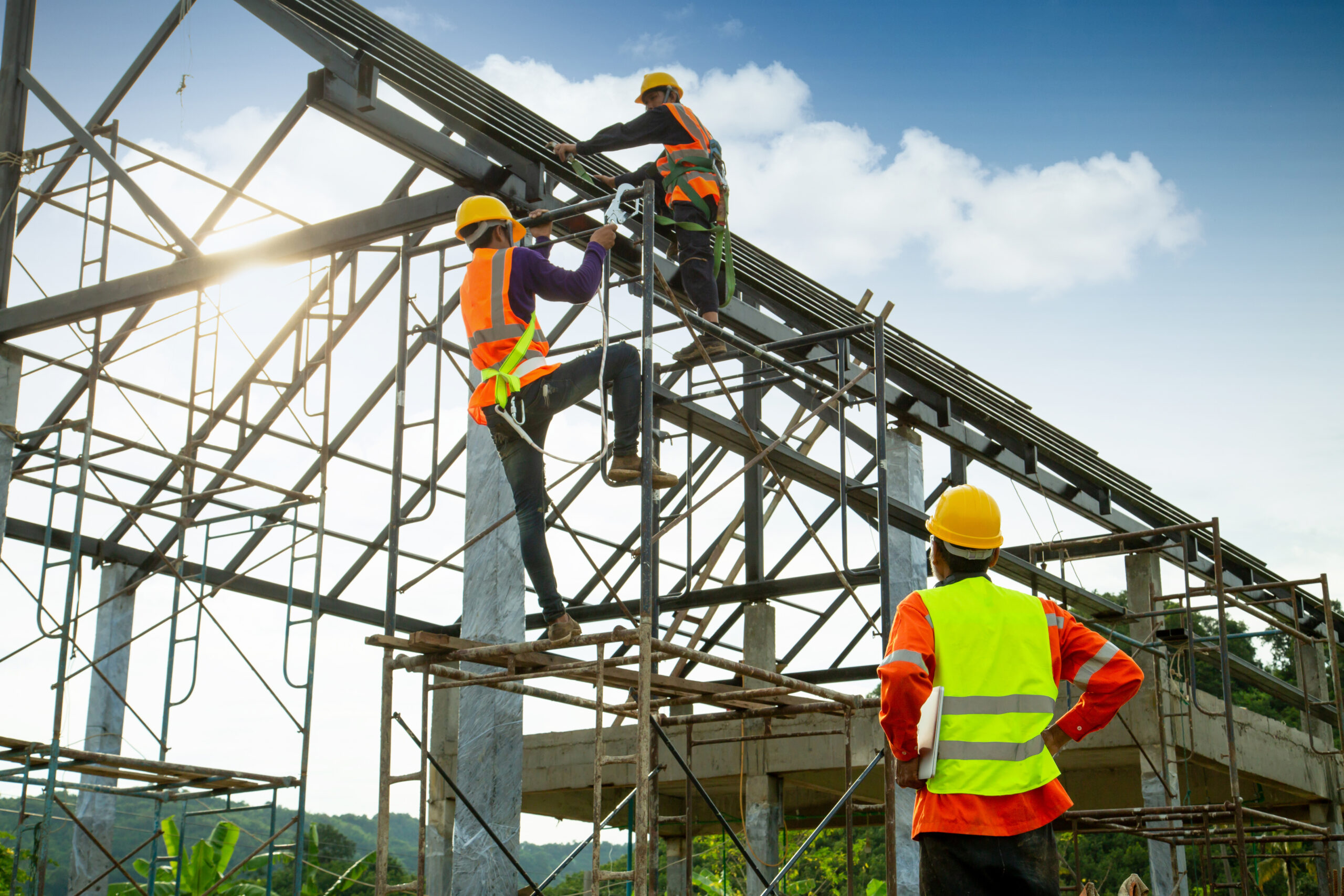 Asian construction worker control in the construction of roof st